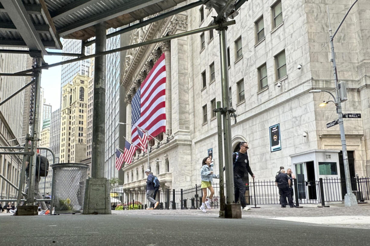 The American flag hangs from the front of the New York Stock Exchange on Wednesday, Sept. 11, 2024, in New York.