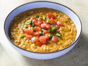 This image released by Milk Street shows a recipe for berbere spiced lentils.