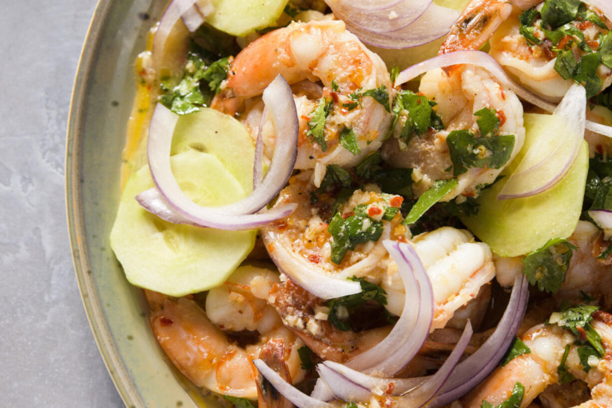 This image released by Milk Street shows a recipe for drunken shrimp with tequila (Camarones Borrachos).