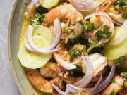 This image released by Milk Street shows a recipe for drunken shrimp with tequila (Camarones Borrachos).