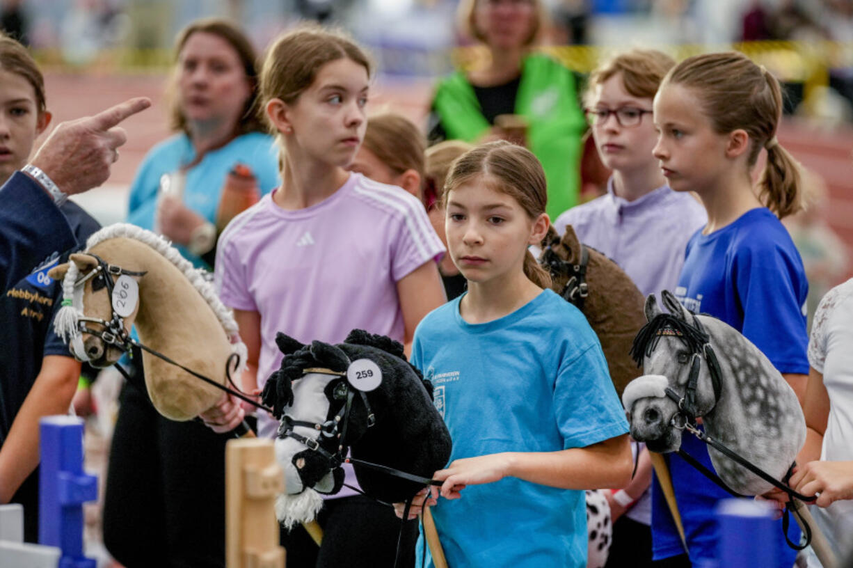 Competitors are instructed during the first German Hobby Horsing Championship in Frankfurt, Germany, Saturday, Sept. 14, 2024.