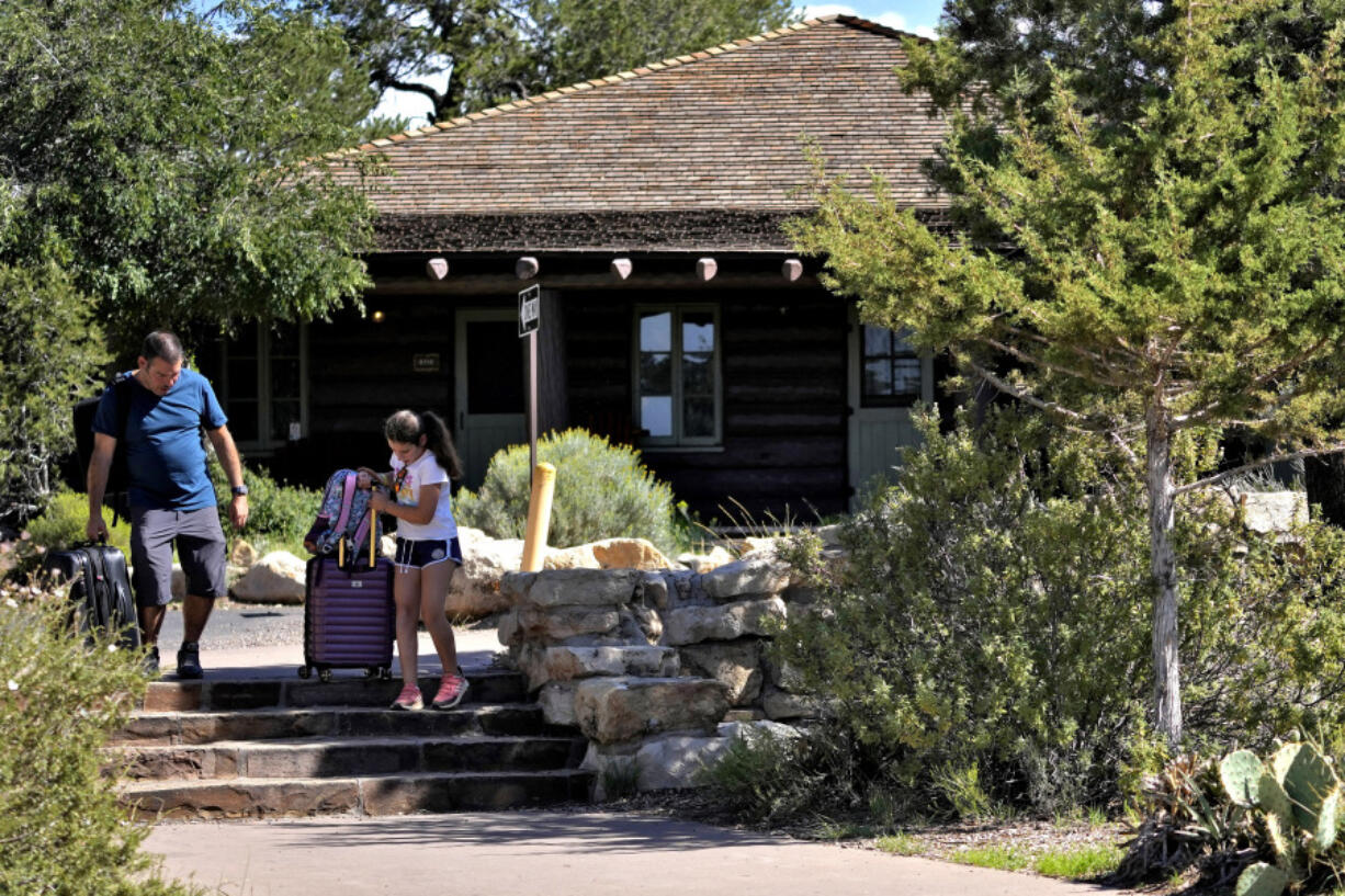 Guests exit Bright Angel Lodge, after visitors won&#039;t be able to stay overnight in hotels at Grand Canyon National Park beginning Thursday after a series of breaks in the only pipeline that serves the popular tourist destination, Thursday, Aug. 29, 2024, in Grand Canyon, Ariz.