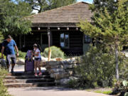 Guests exit Bright Angel Lodge, after visitors won&#039;t be able to stay overnight in hotels at Grand Canyon National Park beginning Thursday after a series of breaks in the only pipeline that serves the popular tourist destination, Thursday, Aug. 29, 2024, in Grand Canyon, Ariz.