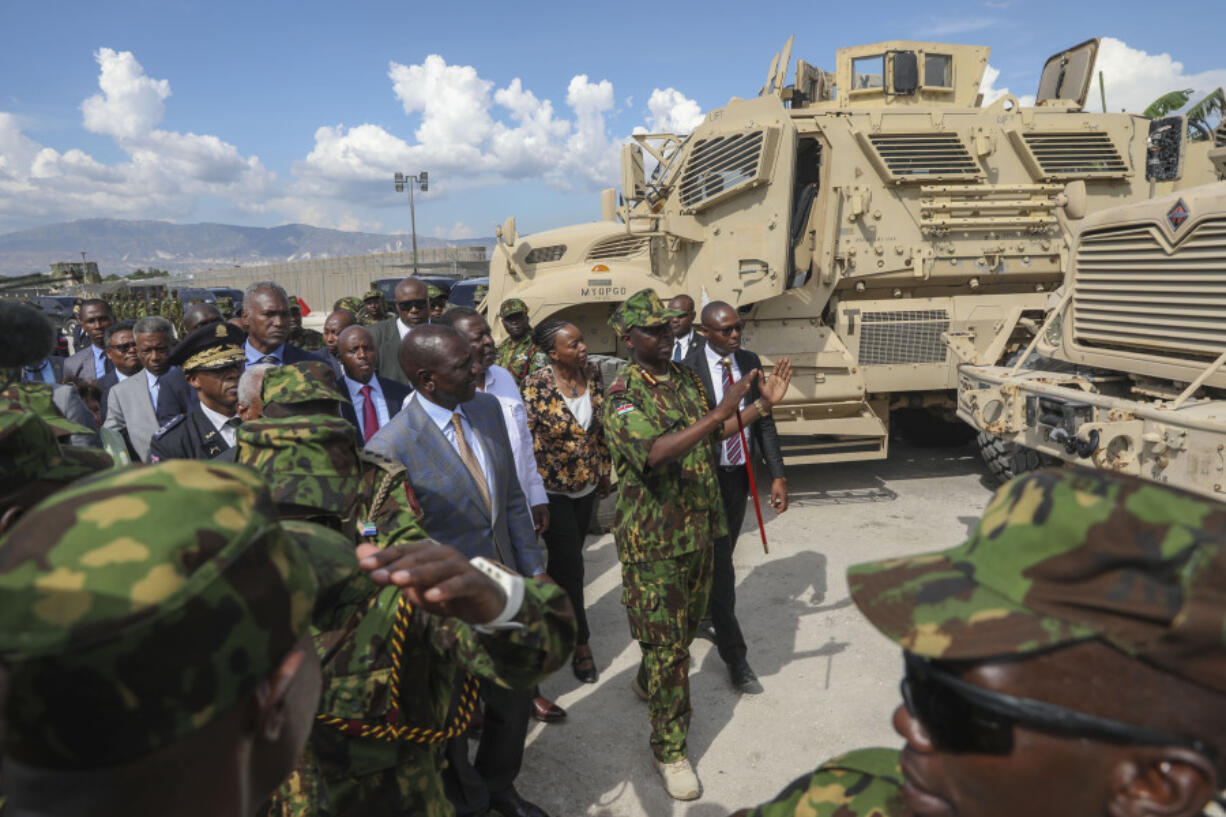 Kenya&rsquo;s President William Ruto, center left, visits Kenyan police, part of a UN-backed multinational force, at their base in Port-au-Prince, Haiti, Saturday, Sept. 21, 2024.