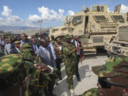 Kenya&rsquo;s President William Ruto, center left, visits Kenyan police, part of a UN-backed multinational force, at their base in Port-au-Prince, Haiti, Saturday, Sept. 21, 2024.