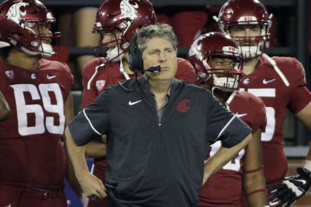 FILE - Washington State head coach Mike Leach stands on the sideline on during the first half of an NCAA college football game against Boise State in Pullman, Wash., Saturday, Sept. 9, 2017.