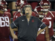 FILE - Washington State head coach Mike Leach stands on the sideline on during the first half of an NCAA college football game against Boise State in Pullman, Wash., Saturday, Sept. 9, 2017.