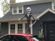 A towering figure of Jack Skellington from the film &ldquo;The Nightmare Before Christmas&rdquo; appears in front of a house in Westchester County, N.Y., on Sept. 23, 2024. The giant skeletons have upped the game on decorations, and Halloween superfans are thrilled.