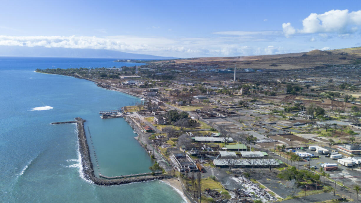 A general view of the burn zone along Front street after the completion of residential primary debris removal and the beginning of commercial debris removal, Saturday, July 6, 2024, in Lahaina, Hawaii.