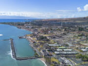 A general view of the burn zone along Front street after the completion of residential primary debris removal and the beginning of commercial debris removal, Saturday, July 6, 2024, in Lahaina, Hawaii.