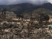 FILE - Damaged property lies scattered in the aftermath of a wildfire in Lahaina, Hawaii, Aug. 21, 2023. (AP Photo/Jae C.