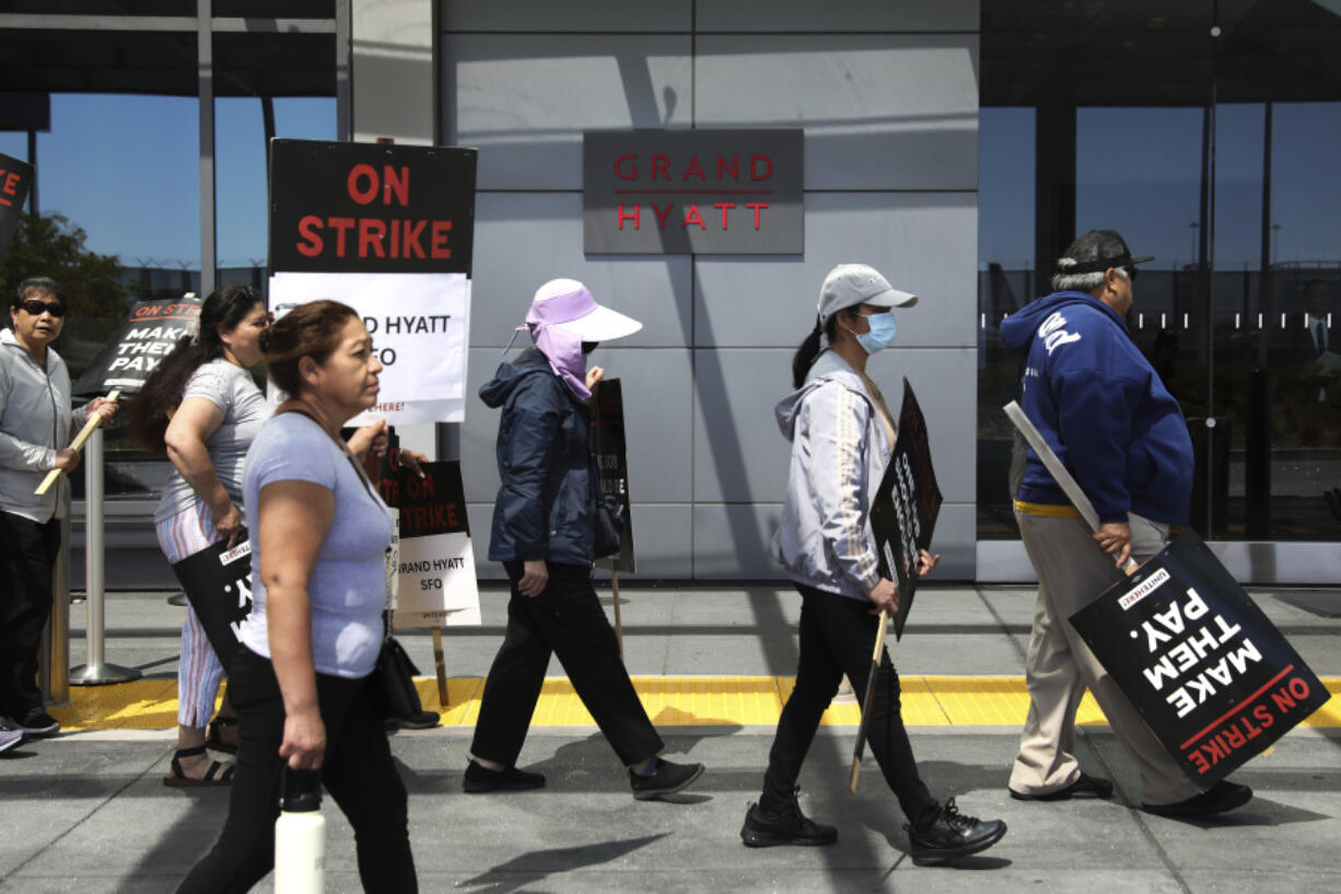 Hotel employees, local officials and members of Unite Here Local 2 union picket outside of the Grand Hyatt at SFO in South San Francisco, Calif., Monday, Sept. 2, 2024, during the second day of a three-day strike with hotel employees across the country.