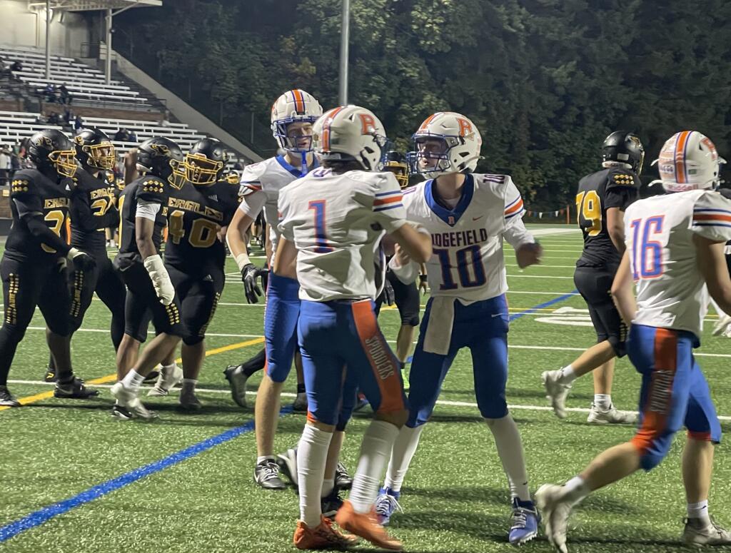 Ridgefield's Wyatt Hemmelman (1) is greeted by quarterback Landon DeBeaumont (10) after the two connected for a 6-yard touchdown during a 2A Greater St. Helens League football game against Hudson's Bay on Friday, Sept. 27, 2024, at Kiggins Bowl.