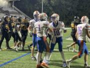 Ridgefield's Wyatt Hemmelman (1) is greeted by quarterback Landon DeBeaumont (10) after the two connected for a 6-yard touchdown during a 2A Greater St. Helens League football game against Hudson's Bay on Friday, Sept. 27, 2024, at Kiggins Bowl.