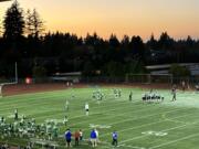 The sun sets on McKenzie Stadium as Mountain View hosts Mountainside of Beaverton, Ore., in a non-league football game Friday, Sept. 29, 2024.