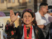 FILE- An Iraqi woman protests against a proposed law to permit underage female marriage in Tahrir Square in Baghdad, Iraq, July 28, 2024. Rights groups and many Iraqi women fear the country&rsquo;s parliament will open the door to child marriages as lawmakers consider legal changes that would give religious authorities more power over family law.