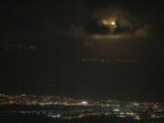 An Israeli army flare is seen over the Israeli-Lebanese border at the Galilee region as seen from the Israeli-annexed Golan Heights, Sunday, Sept. 15, 2024.