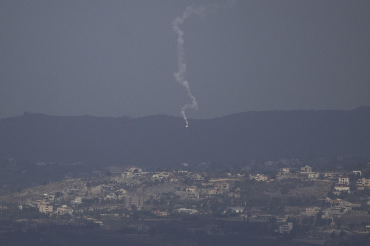 An Israeli army flare is seen over the Israeli-Lebanese border as seen from the Israeli-annexed Golan Heights, Monday, Sept. 16, 2024.