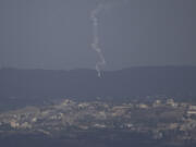 An Israeli army flare is seen over the Israeli-Lebanese border as seen from the Israeli-annexed Golan Heights, Monday, Sept. 16, 2024.