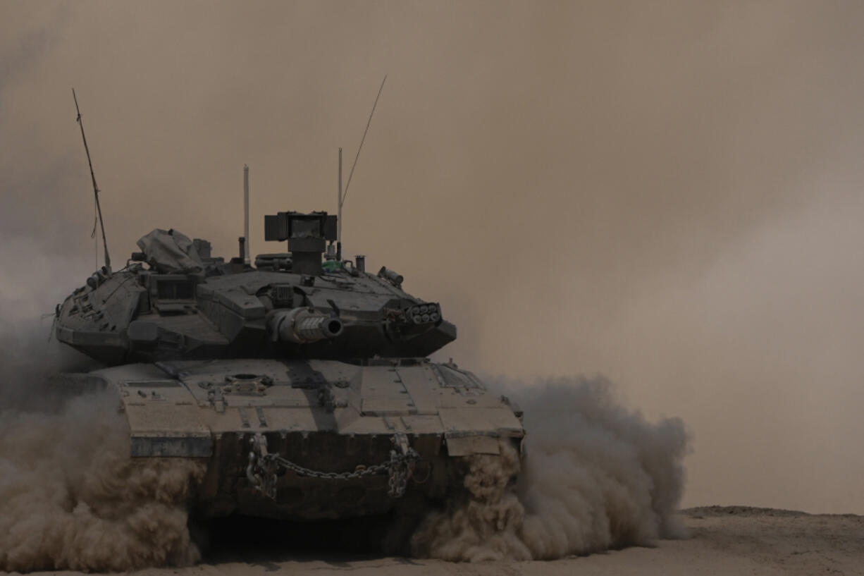 An Israeli tank manoeuvres near the Israel-Gaza border, southern Israel, Thursday, Aug. 29, 2024.