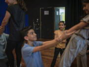 Children rehearse for a show in a theater in Jenin, West Bank, Saturday, June 8, 2024.