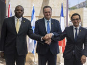 Britain&rsquo;s Foreign Secretary David Lammy, left, and French Foreign Minister St&eacute;phane S&eacute;journ&eacute;, right, are welcomed by Israeli Minister of Foreign Affairs Israel Katz, at their meeting in Jerusalem, Friday, Aug. 16, 2024.