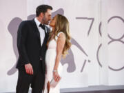 Jennifer Lopez, right, and Ben Affleck kiss at the premiere of the film &ldquo;The Last Duel&rdquo; Sept. 10, 2021, in Venice, Italy.