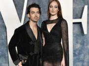 FILE - Joe Jonas, left, and Sophie Turner appear at the Vanity Fair Oscar Party on March 12, 2023, in Beverly Hills, Calif.