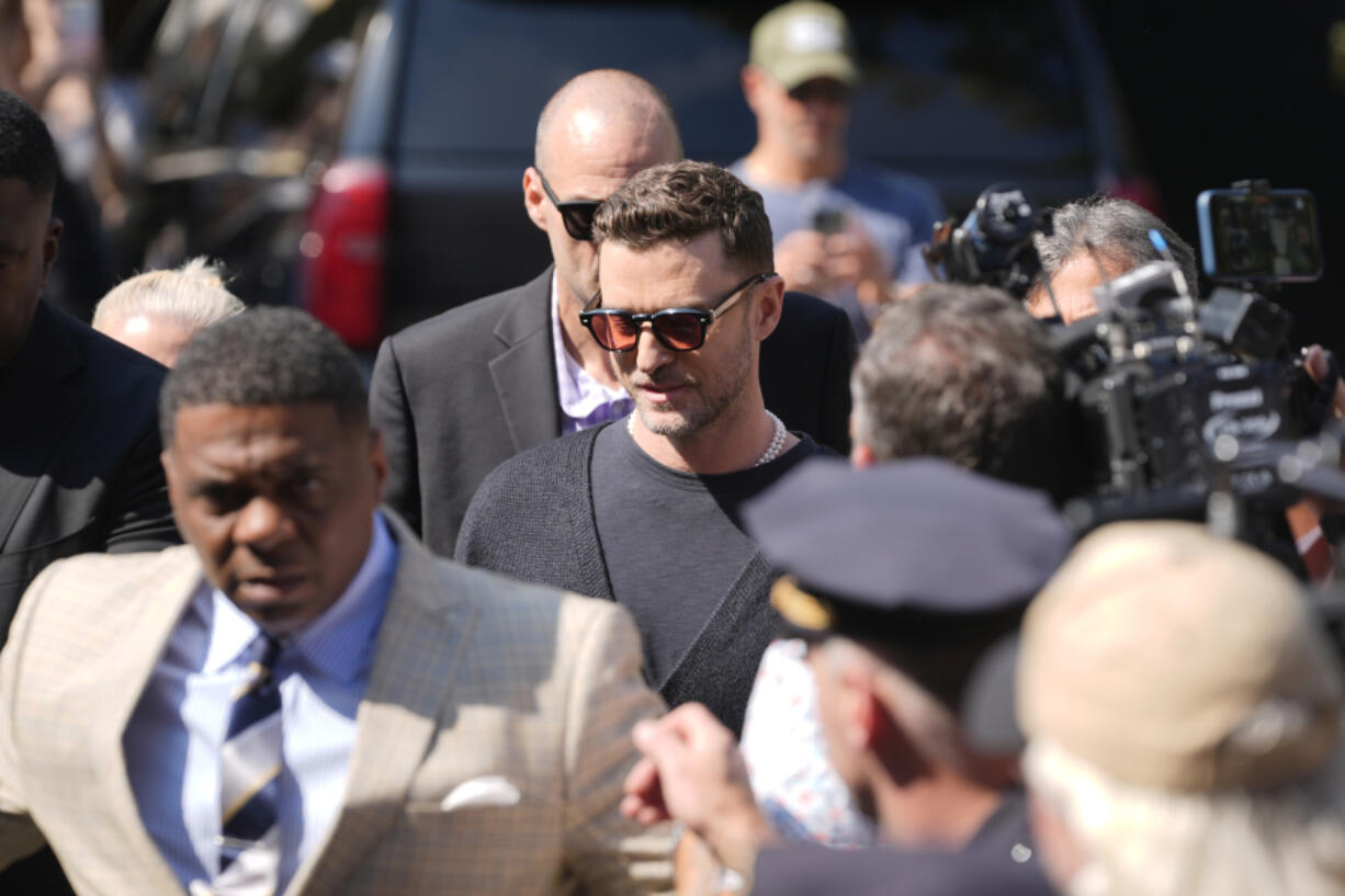 Justin Timberlake, center, walks into court for his arraignment, Friday, Sept. 13, 2024, in Sag Harbor, N.Y.