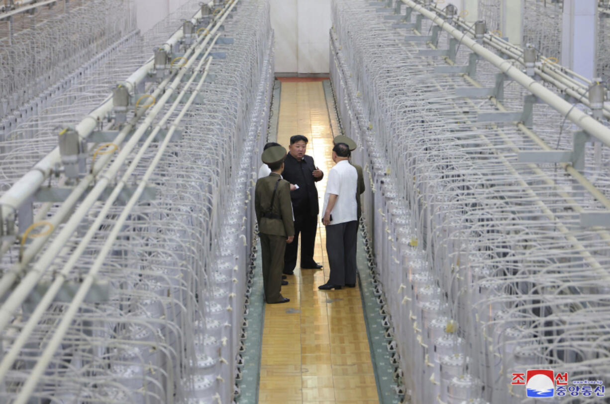 This undated photo provided on Friday, Sept. 13, 2024, by the North Korean government shows its leader Kim Jong Un, center, on an inspecting visit at what they say is an institute of nuclear weapons and a facility for nuclear materials at an undisclosed location in North Korea. Independent journalists were not given access to cover the event depicted in this image distributed by the North Korean government. The content of this image is as provided and cannot be independently verified. Korean language watermark on image as provided by source reads: &quot;KCNA&quot; which is the abbreviation for Korean Central News Agency.