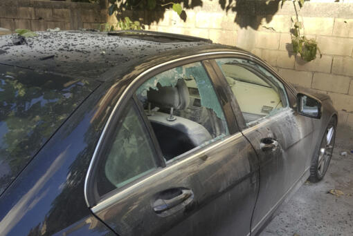 A partly damaged car after what is believed to be the result of a walkie-talkie exploding inside it, in the southern port city of Sidon, Lebanon, Wednesday, Sept. 18, 2024.