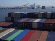 FILE - A container ship makes it way toward the Port of New York and New Jersey in Elizabeth, N.J., on June 30, 2021.