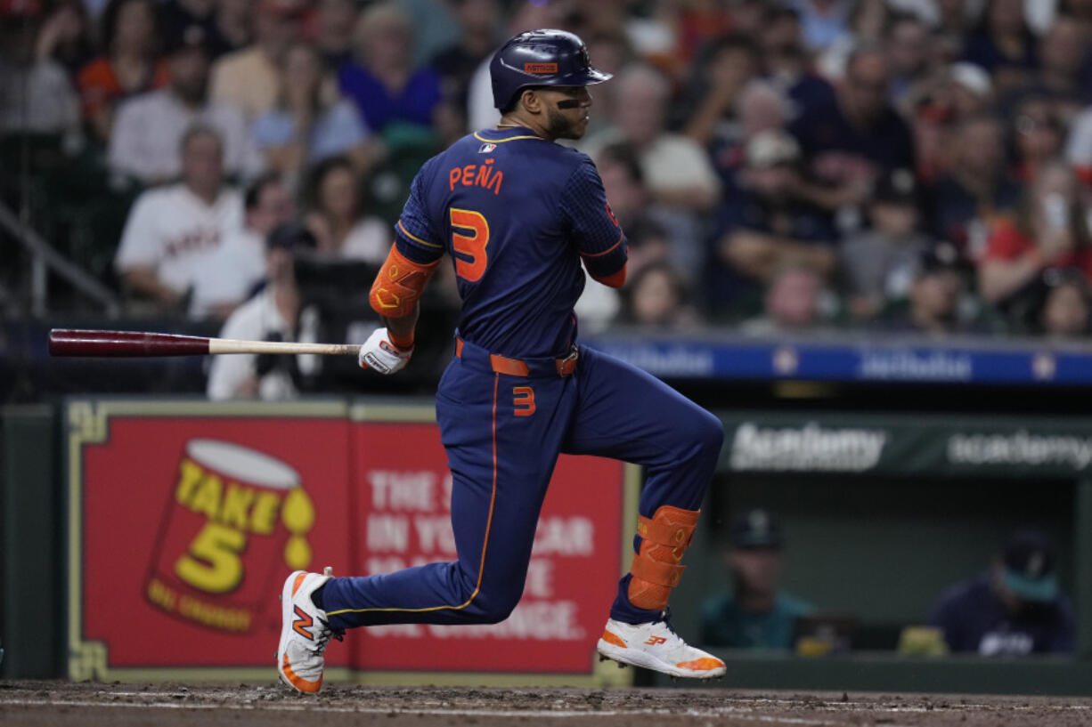 Houston Astros&#039; Jeremy Pe&ntilde;a hits an infield single during the second inning of a baseball game against the Seattle Mariners, Monday, Sept. 23, 2024, in Houston. (AP Photo/Kevin M.