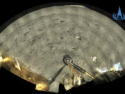 FILE - This Dec. 2, 2020, file image taken by panoramic camera aboard the lander-ascender combination of Chang&#039;e-5 spacecraft provided by China National Space Administration shows a moon surface after it landed on the moon.