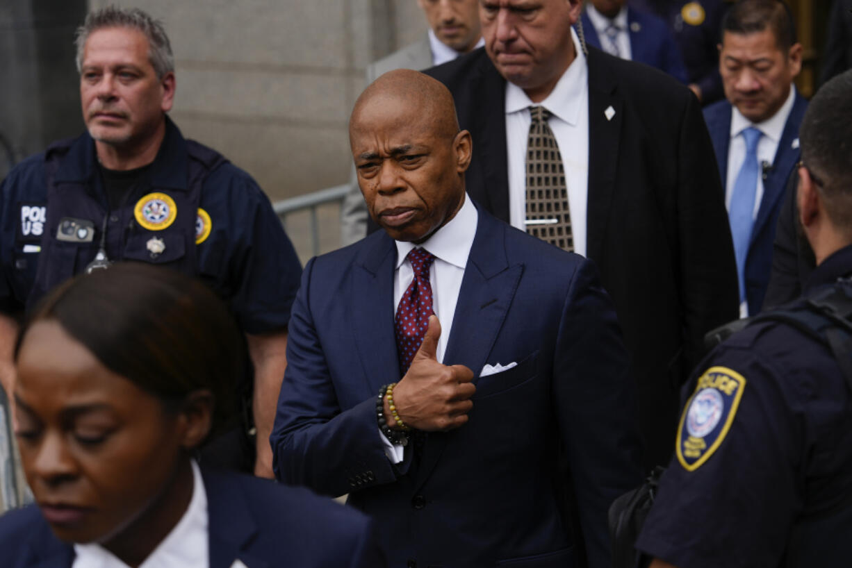 New York City mayor Eric Adams, center, departs Manhattan federal court after an appearance, Friday, Sept. 27, 2024, in New York.