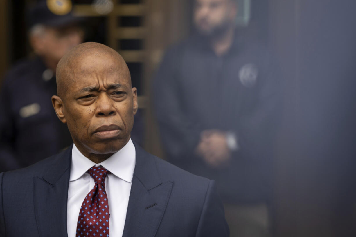 New York City mayor Eric Adams, right, appears outside Manhattan federal court after an appearance, Friday, Sept. 27, 2024, in New York.