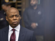 New York City mayor Eric Adams, right, appears outside Manhattan federal court after an appearance, Friday, Sept. 27, 2024, in New York.