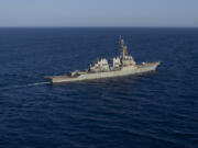 FILE - The Arleigh Burke-class guided missile destroyer USS Laboon sails in the Red Sea, June 12, 2024.