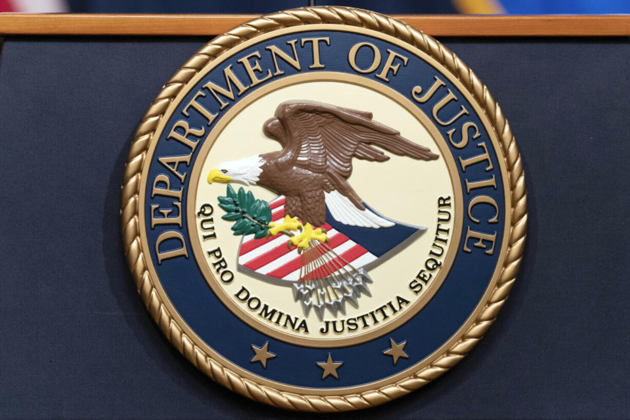 FILE - The Department of Justice seals is seen during a news conference at the DOJ office in Washington, May 16, 2023.