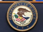 FILE - The Department of Justice seals is seen during a news conference at the DOJ office in Washington, May 16, 2023.