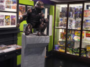 A bronze sculpture of the Teenage Mutant Ninja Turtle character Raphael is displayed Sept. 5 along with comic books and memorabilia in a permanent collection at the Woodman Museum in Dover, N.H.