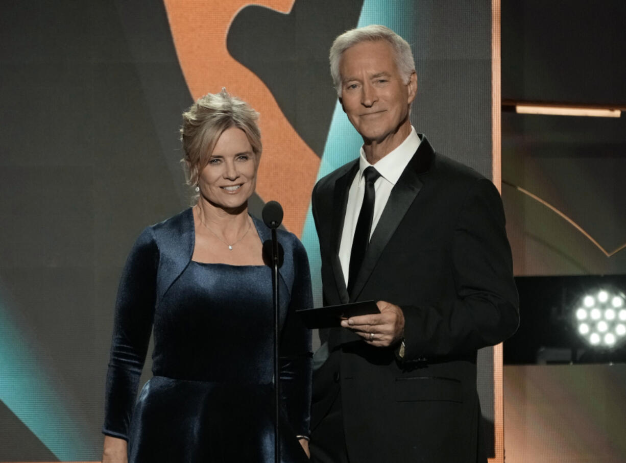 FILE - Mary Beth Evans, left, and Drake Hogestyn present the award for outstanding daytime talk series host during the 50th Daytime Emmy Awards on Friday, Dec. 15, 2023, in Los Angeles. Hogestyn, who played John Black for nearly four decades, has died from pancreatic cancer at age 70.