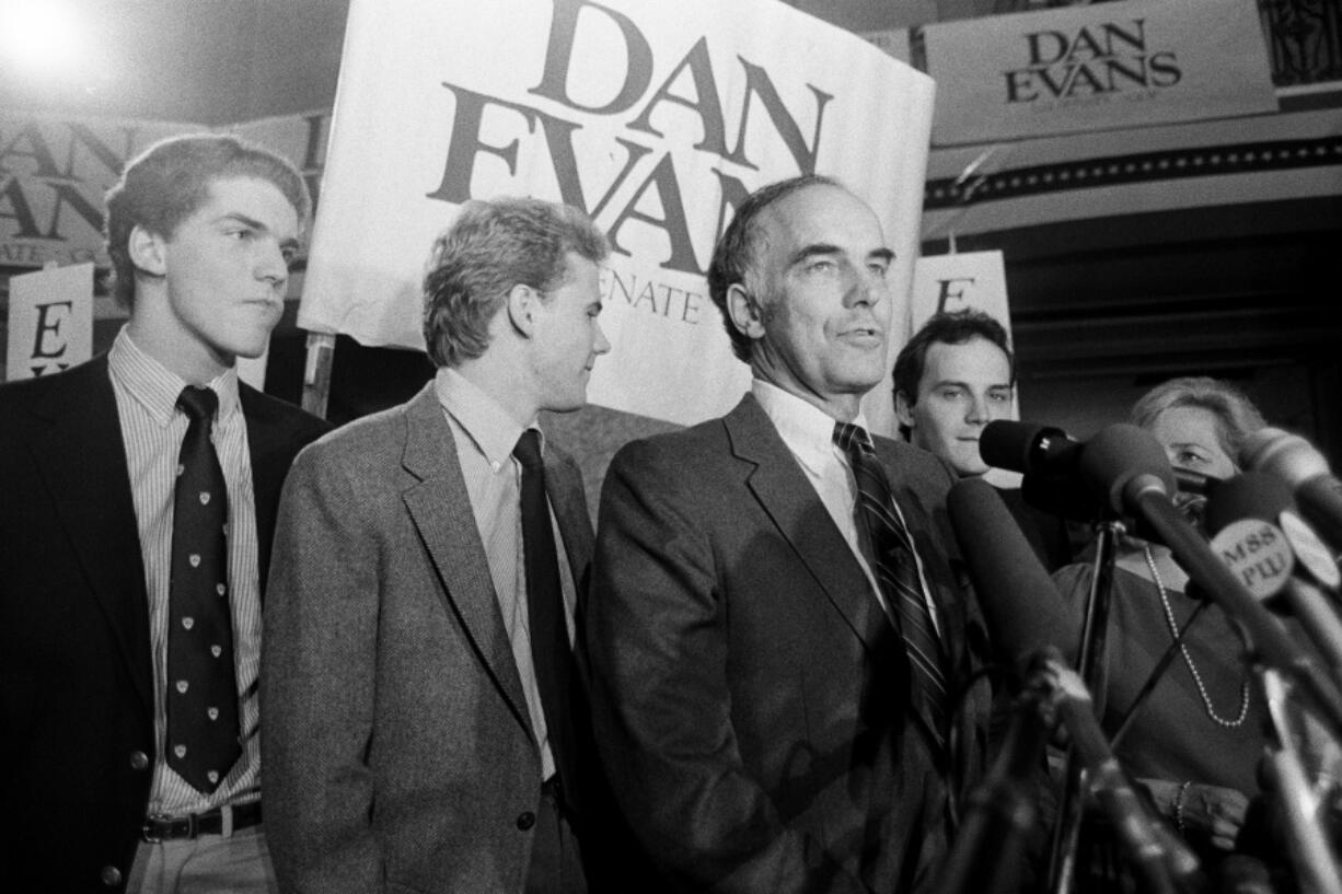 Sen. Dan Evans stands with his three sons &mdash; from left, Mark, Bruce and Dan Jr. &mdash; on Nov. 8, 1983, in Seattle after he won the election for Washington&rsquo;s U.S. Senate seat.