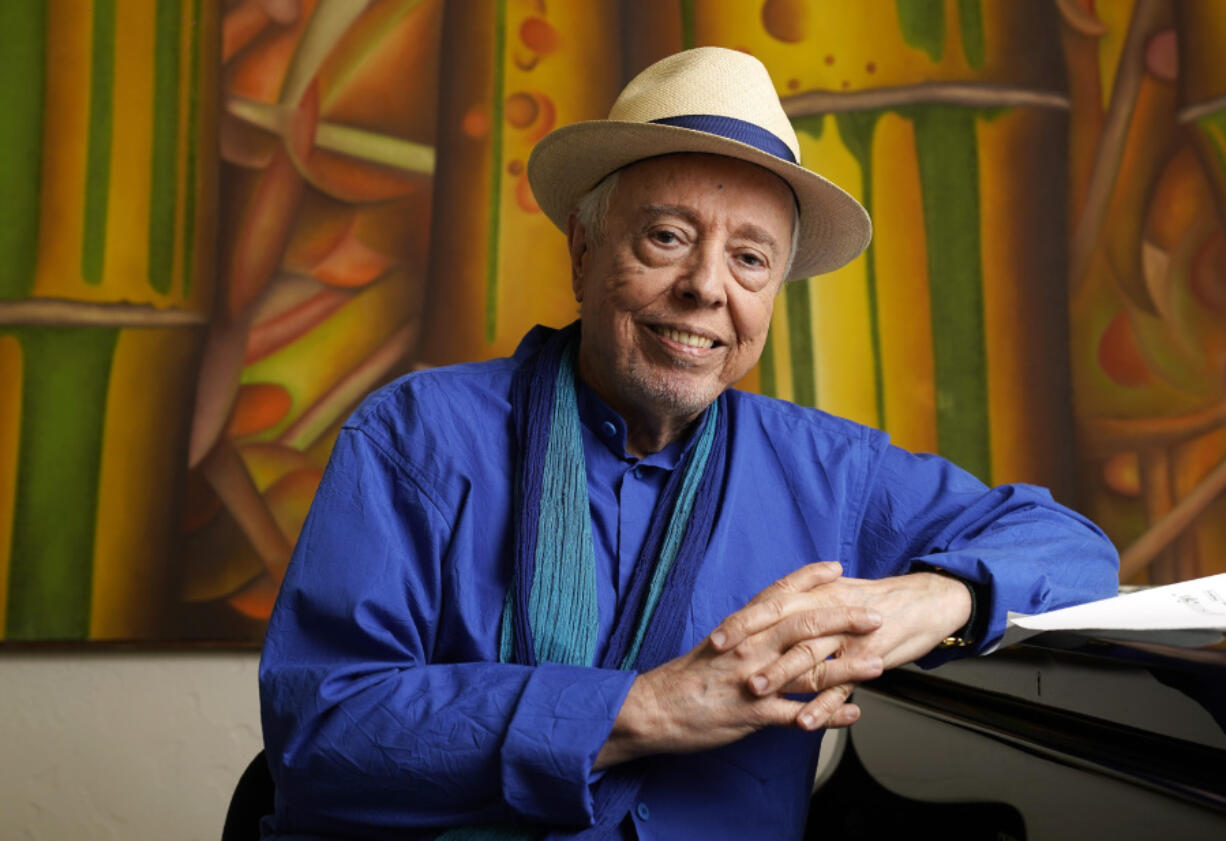 FILE - Brazilian musician Sergio Mendes sits for a portrait at home in Los Angeles, May 18, 2021.