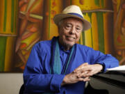 FILE - Brazilian musician Sergio Mendes sits for a portrait at home in Los Angeles, May 18, 2021.