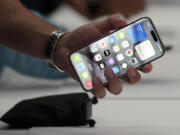 FILE - The iPhone 15 Pro is shown after its introduction on the Apple campus, Sept. 12, 2023, in Cupertino, Calif.