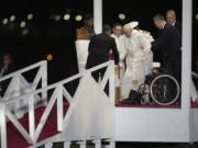 Pope Francis is helped down a ramp at Jackson&rsquo;s International Airport in Port Moresby, Papua New Guinea, Friday, Sept. 6, 2024.