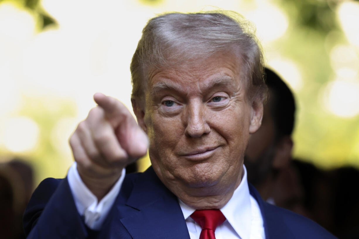 Republican presidential nominee former President Donald Trump motions while attending the 9/11 Memorial ceremony on the 23rd anniversary of the Sept. 11, 2001 terror attacks, Wednesday, Sept. 11, 2024, in New York.