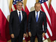 Poland&#039;s Prime Minister Donald Tusk, right, welcomes U.S. Secretary of State, Antony Blinken, left, for a meeting in Warsaw, Poland, Thursday, Sept. 12, 2024.