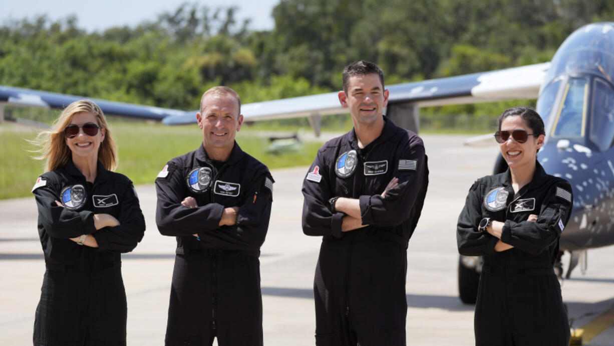 Astronauts, from left, mission specialist Anna Menon, pilot Scott Poteet, commander Jared Isaacman and mission specialist Sarah Gillis arrive at the Kennedy Space Center for an upcoming private human spaceflight mission in Cape Canaveral, Fla., Monday, Aug. 19, 2024.